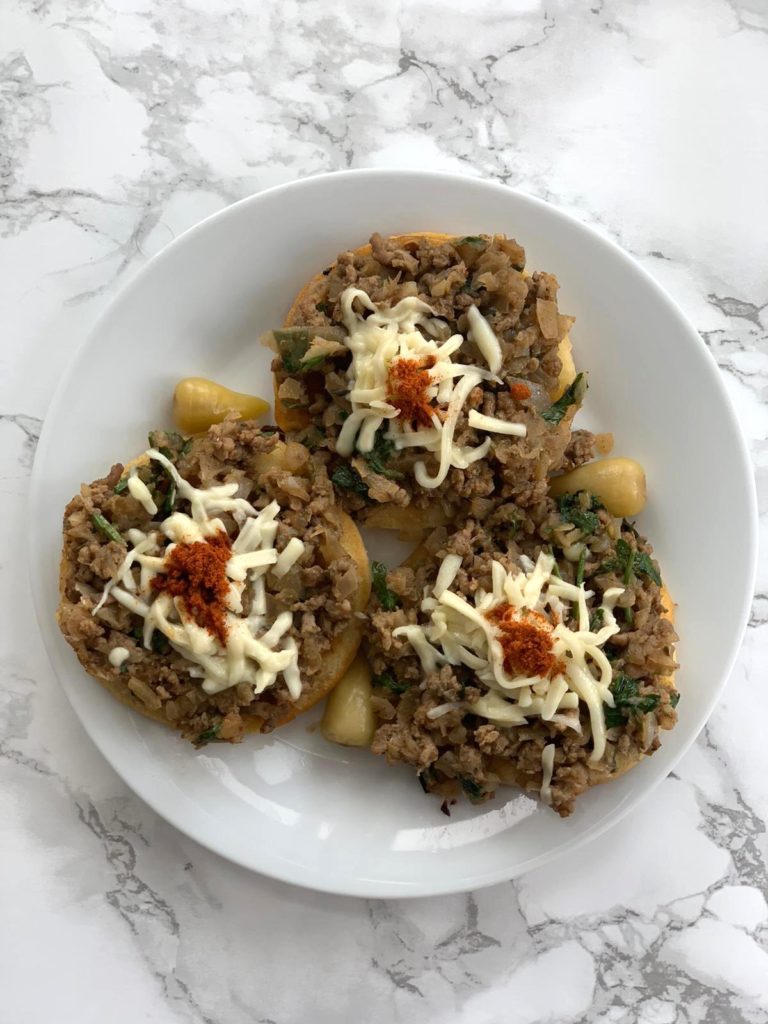 Savory mini pancakes with meat topping