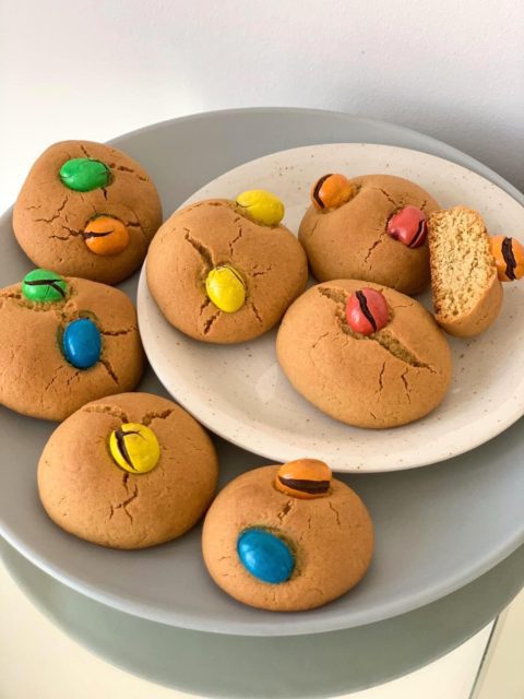 Plates full of colourful peanut M&M cookies. 